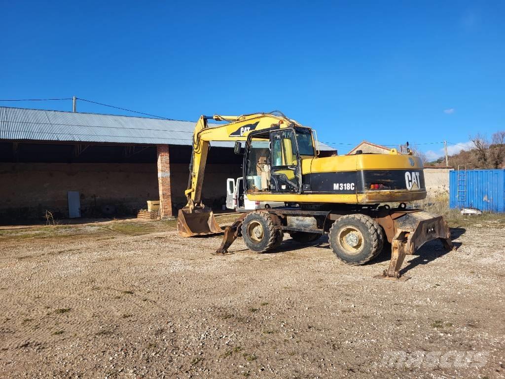 CAT M318c Mobilbagger